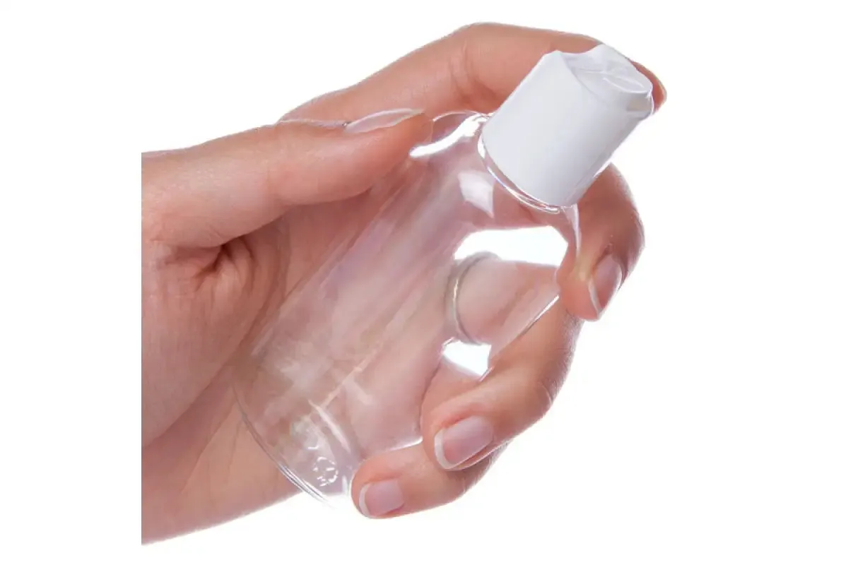 2 oz. Clear Oval Plastic Bottle with White Disc-Top Cap